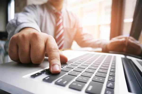 Hands of business people typing on a keyboard chatting online