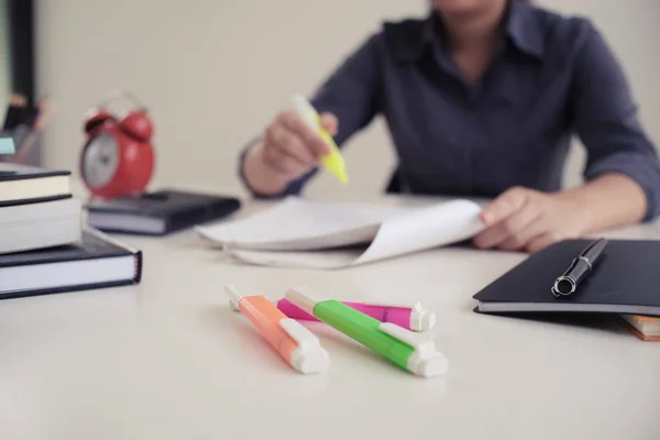 Student writes information from portable tablet while prepare fo