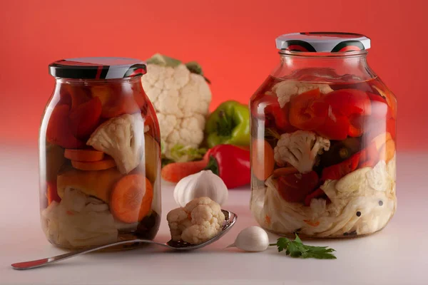Homemade pickle of pickled vegetables in a glass jar. Traditional Bulgarian royal pickle. Preparing for winter.