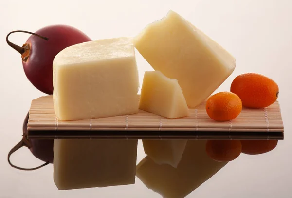 Yellow cheese from cow\'s milk, cut into pieces.