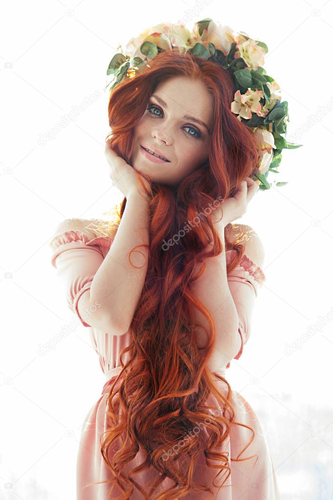 beautiful unusual girl in a wreath on the head