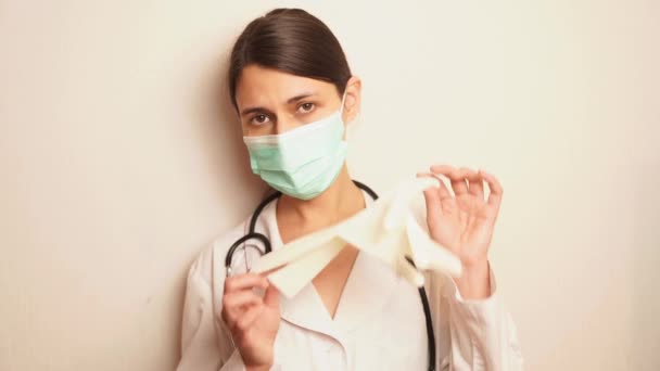 Doctor Therapist Woman White Coat Disposable Blue Mask Puts Disposable — Stock Video