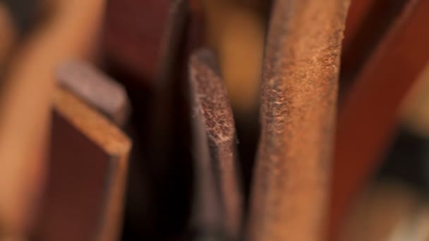 Various pieces of leather in the workshop macro closeup — Stock Video