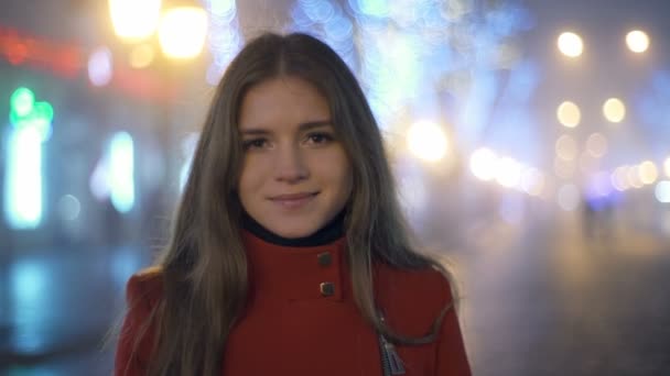 Young woman looking at the camera on the street slow motion — Stock Video