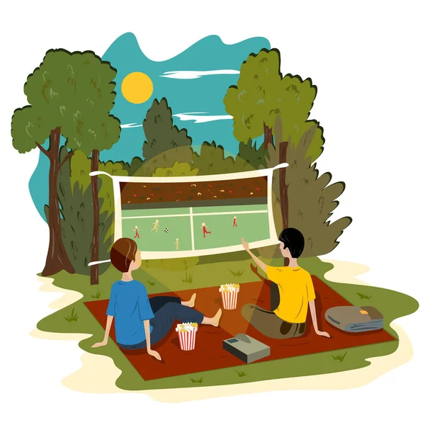Young guys sit in the park outdoors and watch a football match on the projector. — 스톡 벡터