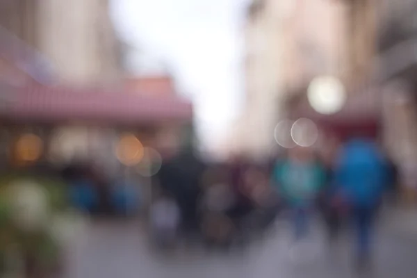 Street in european city in bokeh. Defocused background. — Stock Photo, Image