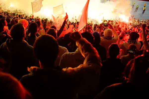 Football- soccer fans support their team and celebrate goal in full stadium with open air with nice sky.-blur picture. — Stock Photo, Image