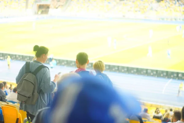 Football- soccer fans support their team and celebrate goal in full stadium with open air with nice sky.-blur picture. — Stock Photo, Image