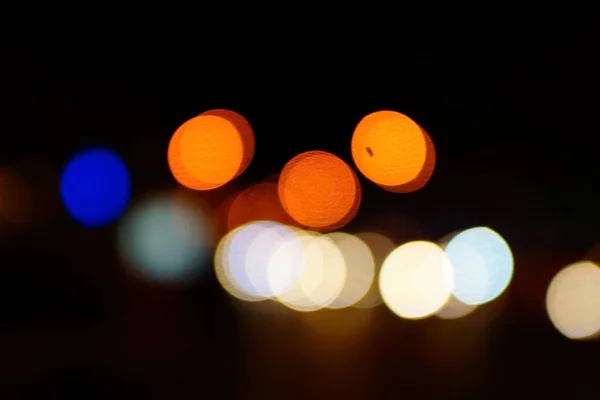 Light night at city blue bokeh abstract background blur lens flare reflection beautiful circle glitter lamp street with dark sky festival firework