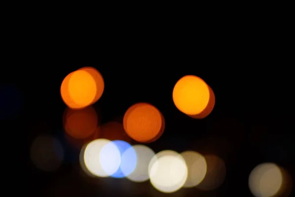 Light night at city blue bokeh abstract background blur lens flare reflection beautiful circle glitter lamp street with dark sky festival firework