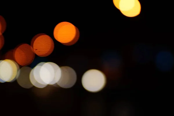 Light night at city blue bokeh abstract background blur lens flare reflection beautiful circle glitter lamp street with dark sky festival firework