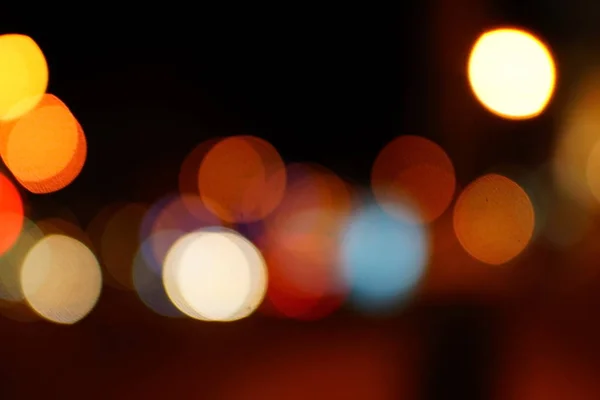 Light night at city blue bokeh abstract background blur lens flare reflection beautiful circle glitter lamp street with dark sky festival firework