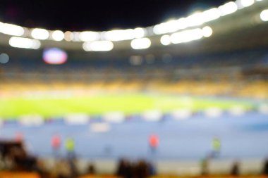 Bulanık boş gece grand futbol ışıklar arenada. Futbol ya da futbol oyuncu. Bokeh ile soyut spor arka plan.