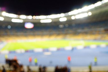 Bulanık boş gece grand futbol ışıklar arenada. Futbol ya da futbol oyuncu. Bokeh ile soyut spor arka plan.
