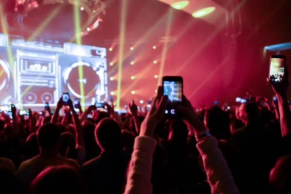 Close up of photographing with smartphone during a concert — Stock Photo, Image