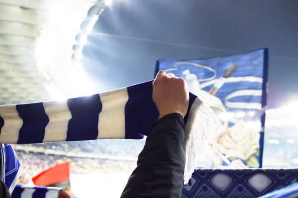 Football fans keep scarves with the color of their clubs — Stock Photo, Image