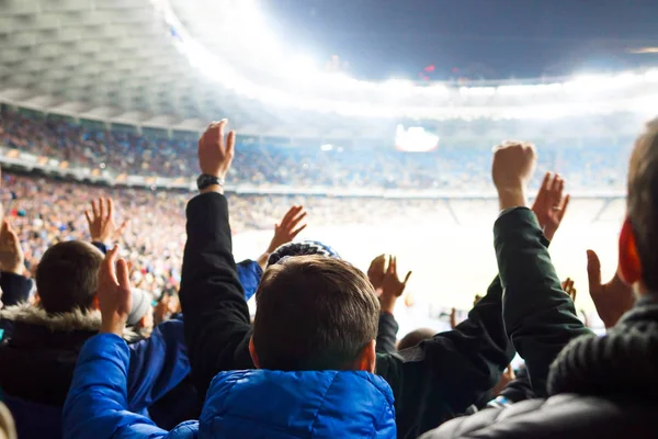 fans at the stadium support the cotton sports club