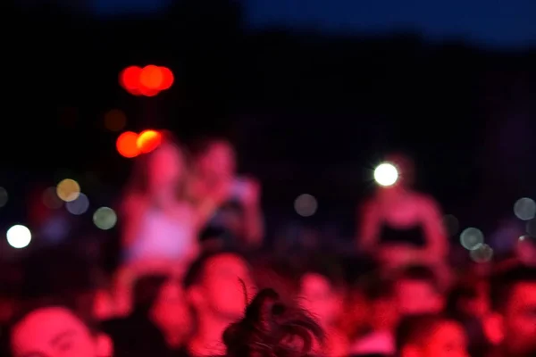 concert background, hand up , blurry background, beautiful bokeh live concert