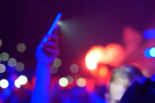 concert background, hand up , blurry background, beautiful bokeh live concert