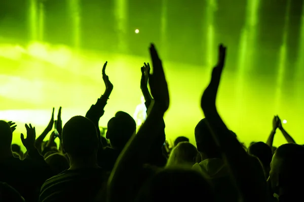 Crowd at a music concert, audience raising hands up — Stock Photo, Image