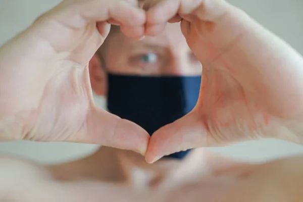 Guy Medical Mask Folds His Hands His Heart — Stock Photo, Image