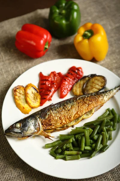 Healthy and proper food, grilled fish and vegetables