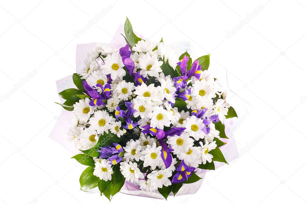 Bouquet of flowers from chamomiles and irises