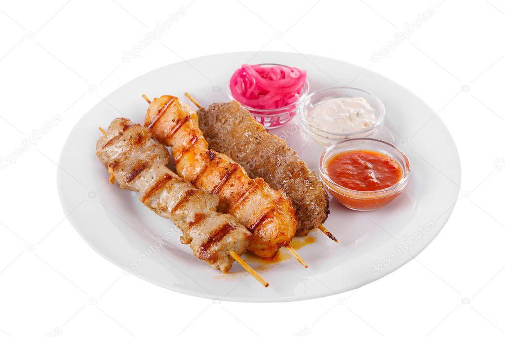 Assorted shish kebab plate isolated on white