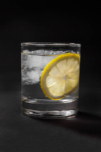 Summer cocktail on isolated black background