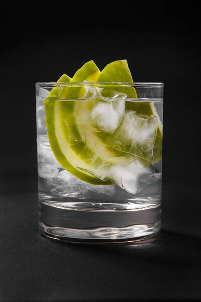 Summer cocktail on isolated black background