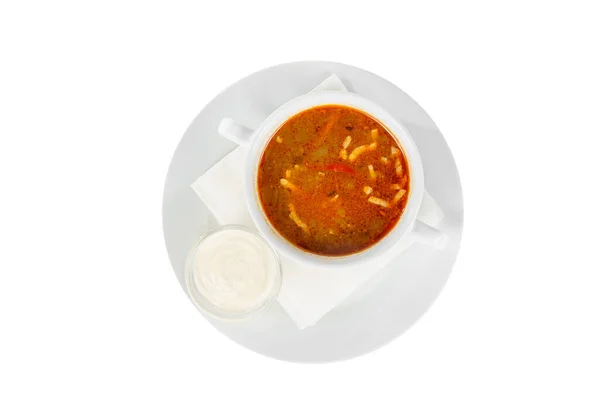 Soppa i en vit platta isolerade vit Stockbild