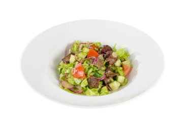 Caesar salad with chicken liver on plate white isolated