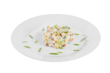 salad with honey mushrooms and green onions on plate white isolated