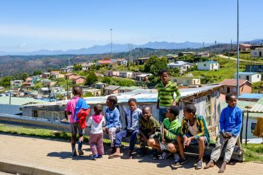 Children in a Knysna township near Mandela houses clipart