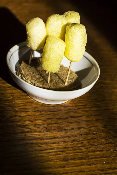 Child\'s dish. Corn sticks on toothpicks are stuck in bread.