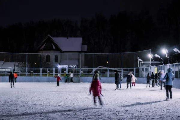 people skate on ice in winter