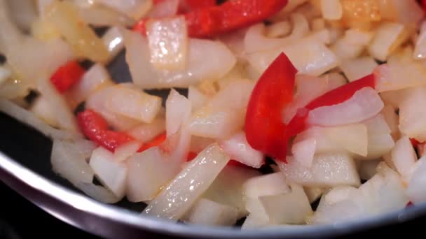 Fried onions fried in pan, red pepper. Home cooking, cooking fried vegetables — Stok video