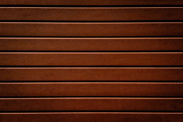 Naranja imitación textura de fondo de madera la valla, revestimiento. Valla de plástico naranja imitación madera rayada — Foto de Stock