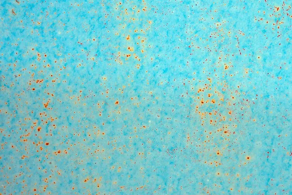 Fond : surface métallique rouillée avec écaillage de peinture bleue et texture fissurante — Photo