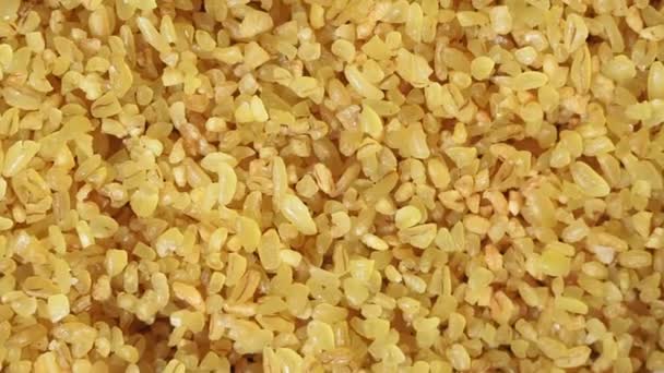 Yellow bulgur grits, a close-up view of wheat — Stock Video