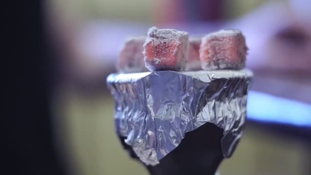 Coals on a hookah bowl on foil close-up — Stock Video