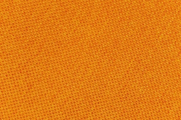 Sfondo fatto di un primo piano di una trama di tessuto arancione — Foto Stock
