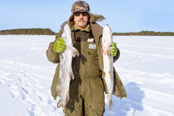 Fishing, freshwater fishing, bait fishing. Winter, winter sports winter fishing. Trophies two large pike, fishing in winter — Stock Photo, Image