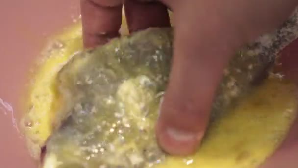 Cooking sea fish breading from eggs. Close-up of flounder fillet — Stock Video