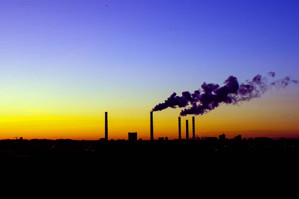 Pollution and smoke from chimneys of factory or power plant. concept of environmental pollution
