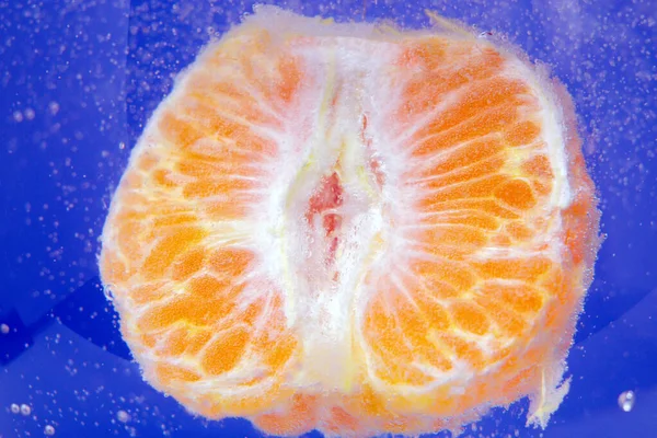 mandarin super macro close up. Tangerines fresh large vibrant color in water, under water