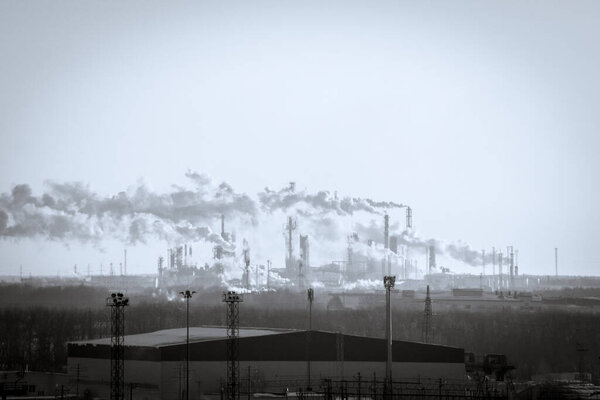 Ecology, smoke in the sky, black and white photo. Ecology, plants, the concept of air pollution and the environment