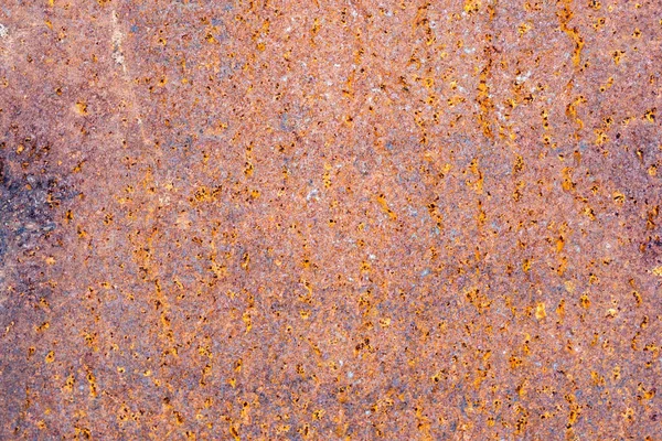 old red paint rust. Rusted painted metal wall. Old Rusty background with streaks of rust. Rust stain.