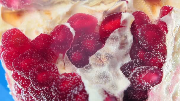 Pomegranate fruit under water close -up selective macro focus. — Stock Video