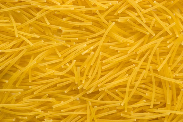 Krátké Tenké Vermicelli Celém Pozadí Textura Suchých Žlutých Těstovin — Stock fotografie